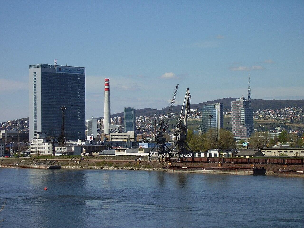 Bratislava city skyline viewed across the Danube River on a clear day