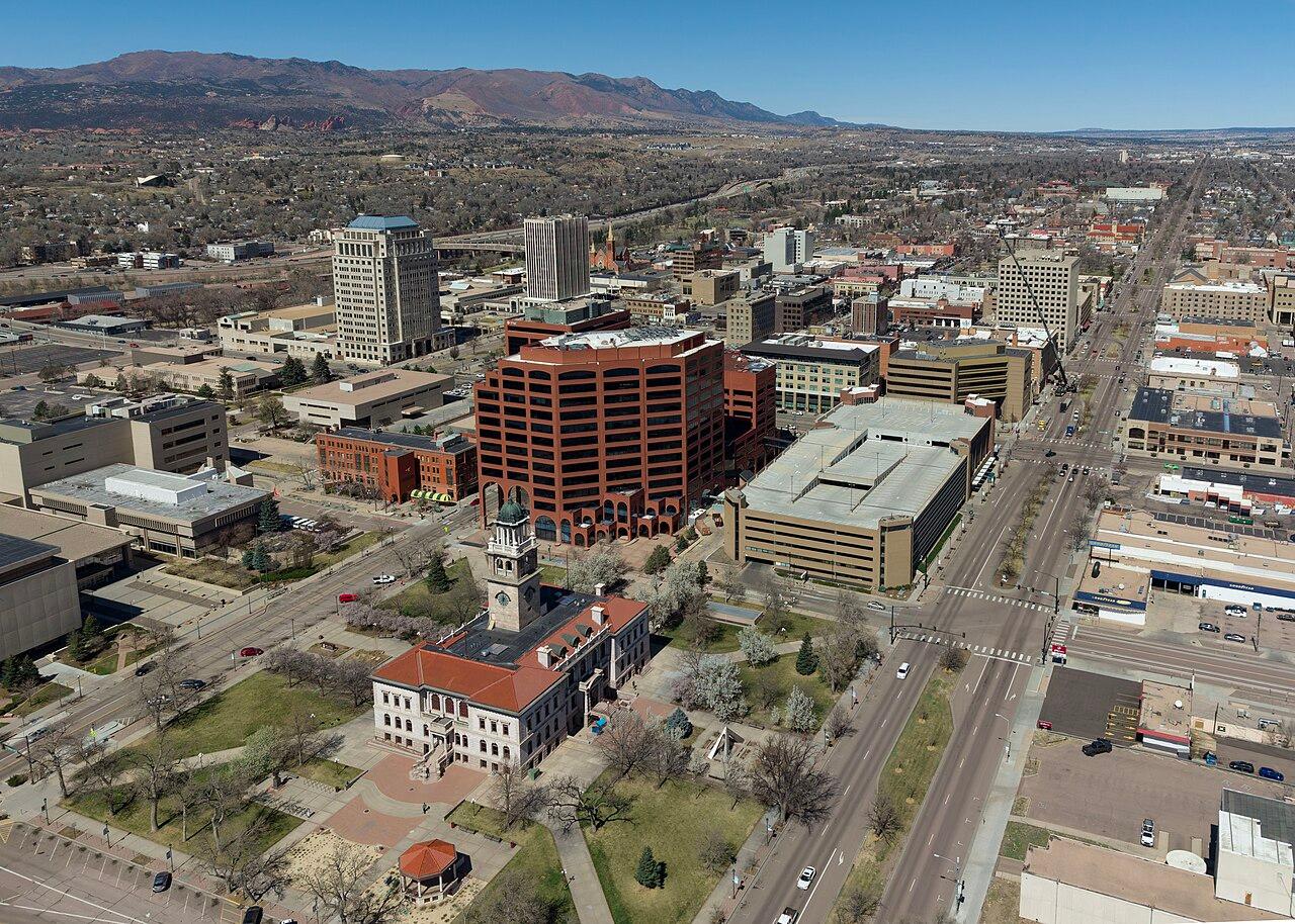 Satellite aerial view of Colorado Springs Airport terminal and parking lots