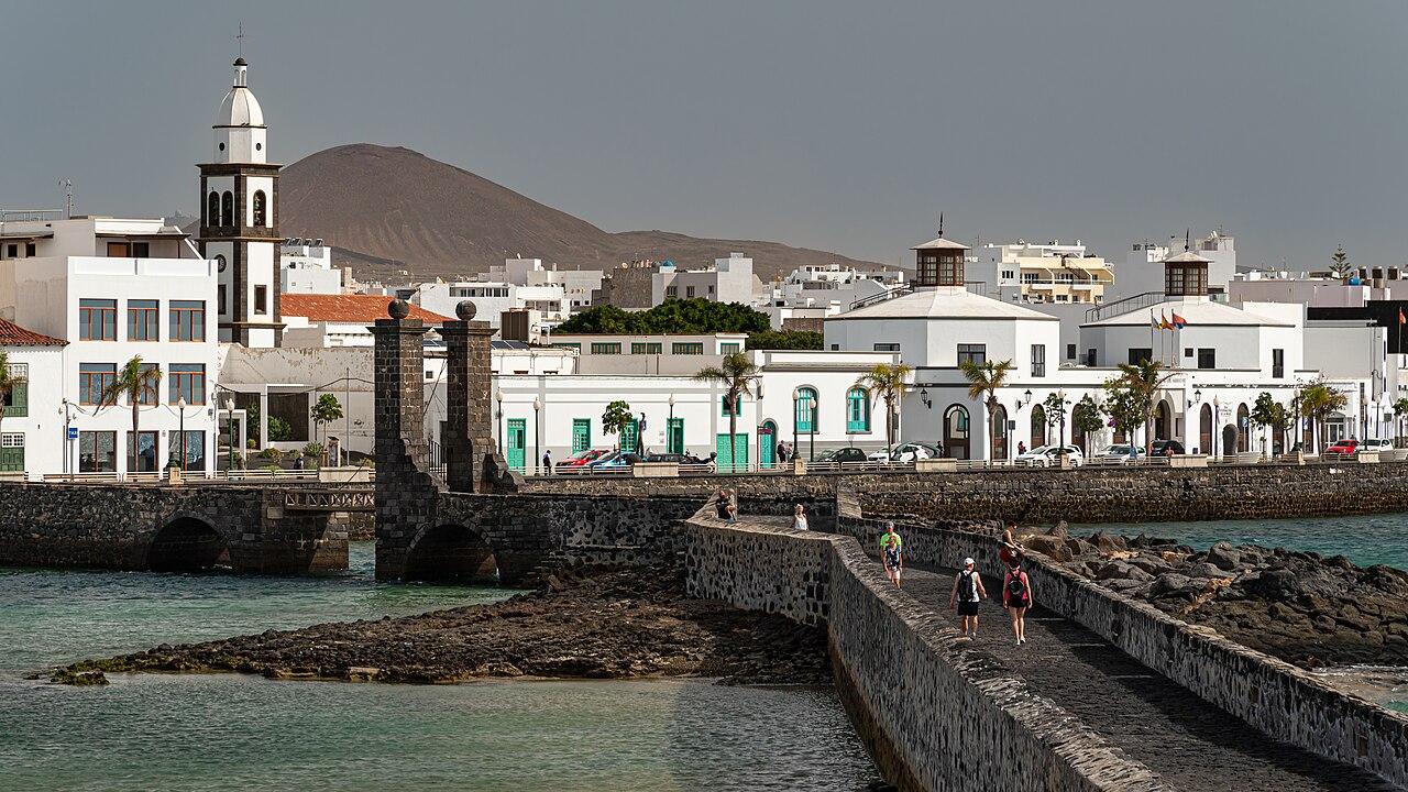 Aircraft on Lanzarote Airport runway at golden sunset