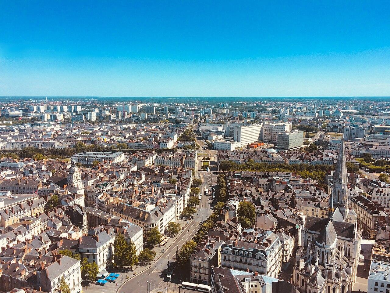 Aerial view of Nantes city centre with blue sky overhead