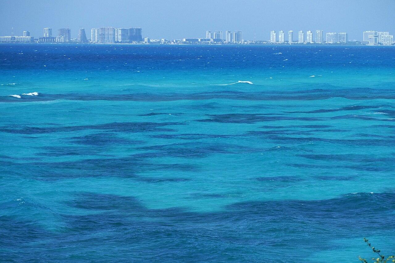 Cancun city skyline viewed across turquoise Caribbean waters