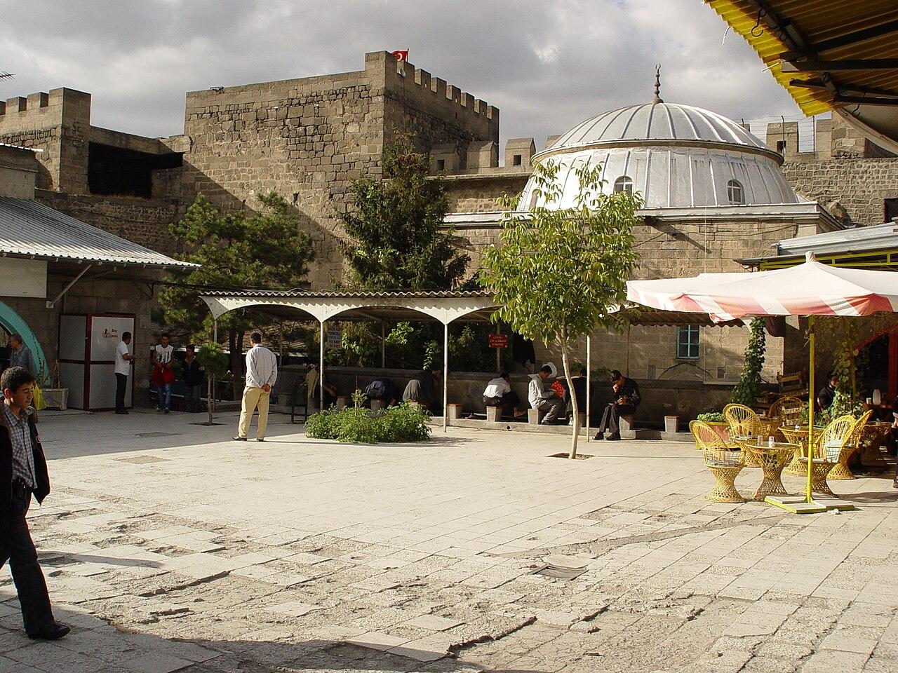 Kayseri Erkilet Airport interior atrium with fountain and tropical plants viewed from above