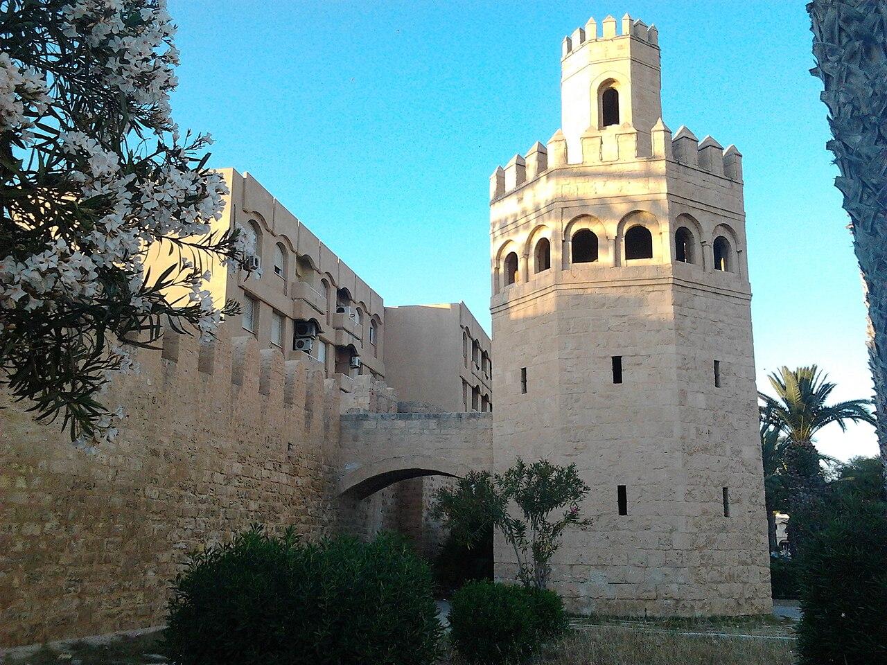 Monastir Habib Bourguiba Airport terminal exterior with control tower and parked aircraft